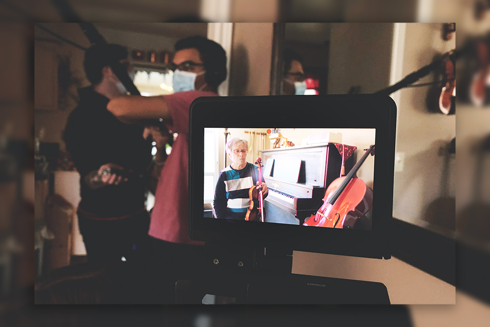 Our subject Eloise is shown on the camera monitor with our sound recordist and producer in the background, hard at work!